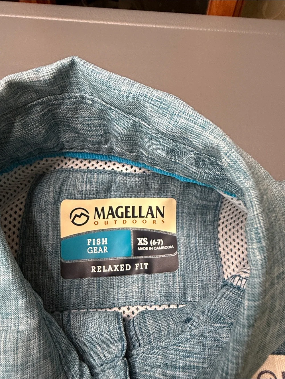 Kid’s Magellan Outdoors Short-Sleeve Button-Front Shirt. Light Blue Heather XS